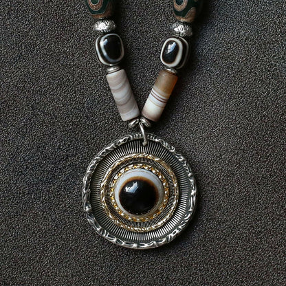handcrafted Nepalese medicine eye Dzi bead necklace gray white round eye pendant detail