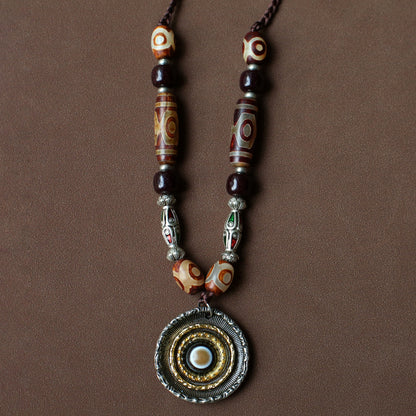 handcrafted Nepalese medicine agate Dzi bead necklace red brown front view