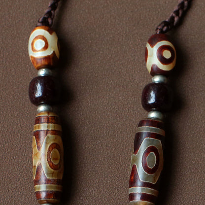handcrafted Nepalese medicine agate Dzi bead necklace red brown cord and accessory detail