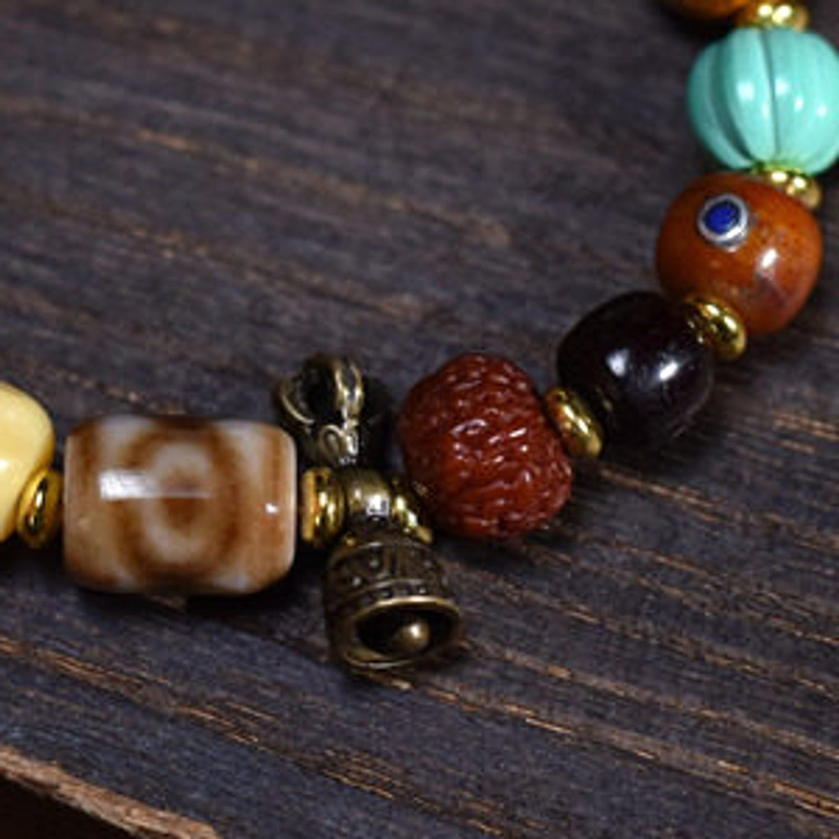 Handcrafted Bone Dzi-Style Mixed-Bead Bracelet - bell and spacer detail