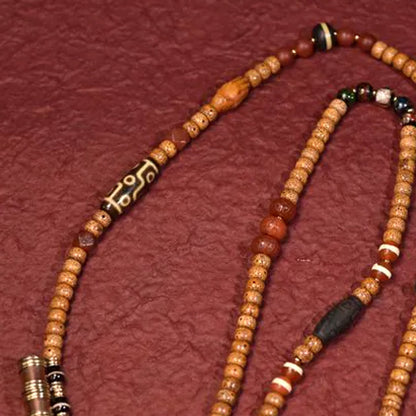 Handcrafted Star and Moon Bodhi Long Necklace - patterned bead detail