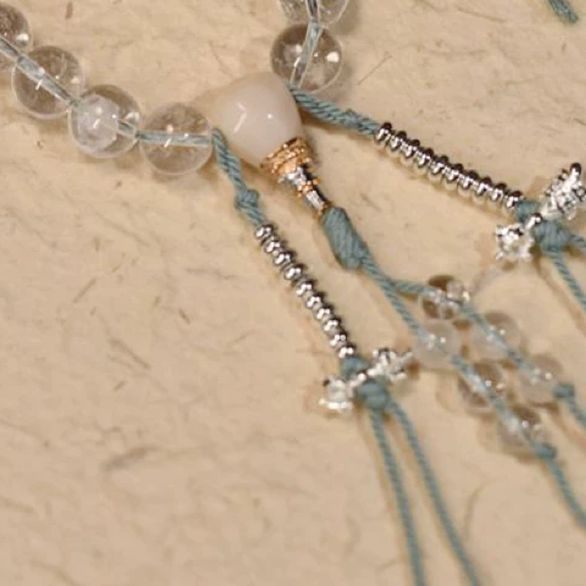 Handcrafted Himalayan Clear Quartz 21-Bead Mala - focal and counter detail