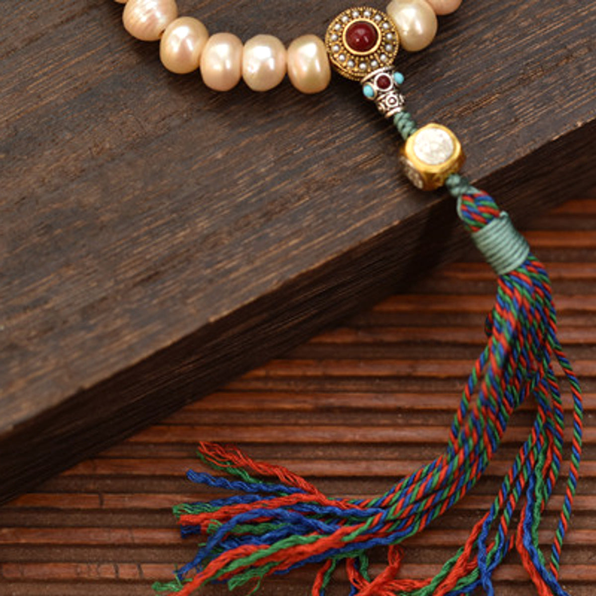 Handcrafted Champagne Pearl Bracelet with Tassel - pendant and pearl detail
