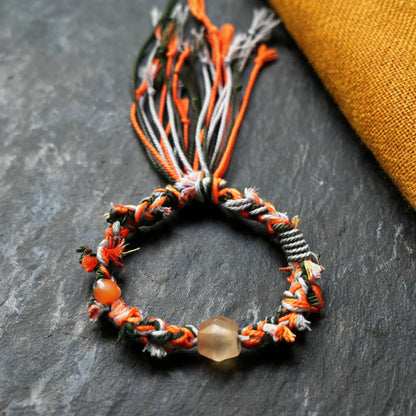 Zhu Xia hand-braided glass bead bracelet central bead detail