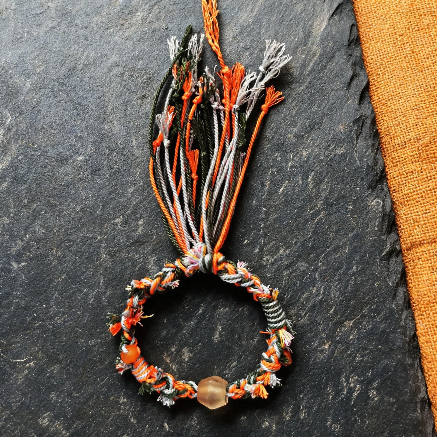 Zhu Xia hand-braided glass bead bracelet braiding detail