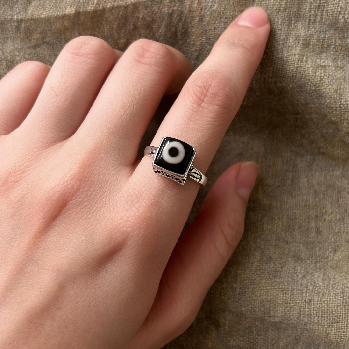 Handcrafted one-eyed Dzi S925 adjustable ring style 1 wearing scale view