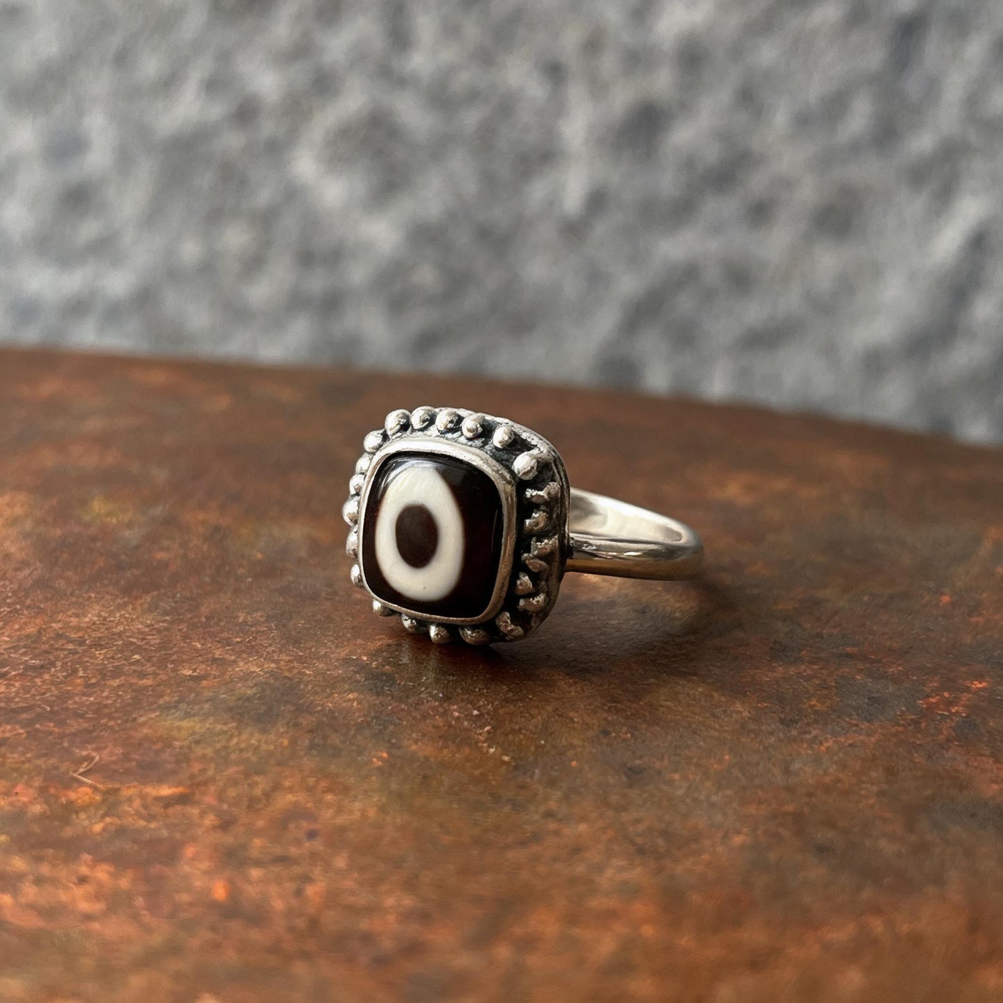 Handcrafted one-eyed Dzi S925 adjustable ring style 2 silver setting side view