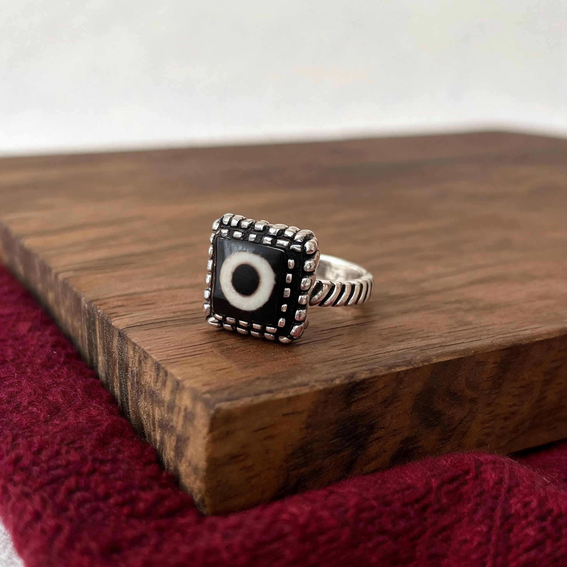 Handcrafted one-eyed Dzi S925 adjustable ring style 3 silver setting side view