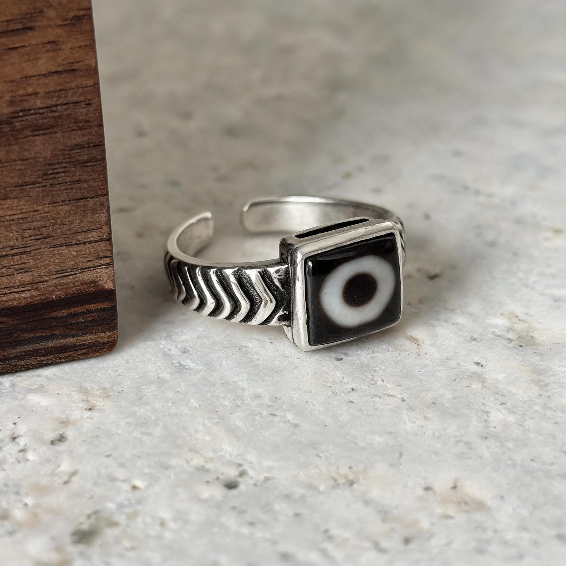 Handcrafted one-eyed Dzi S925 adjustable ring style 4 silver setting side view