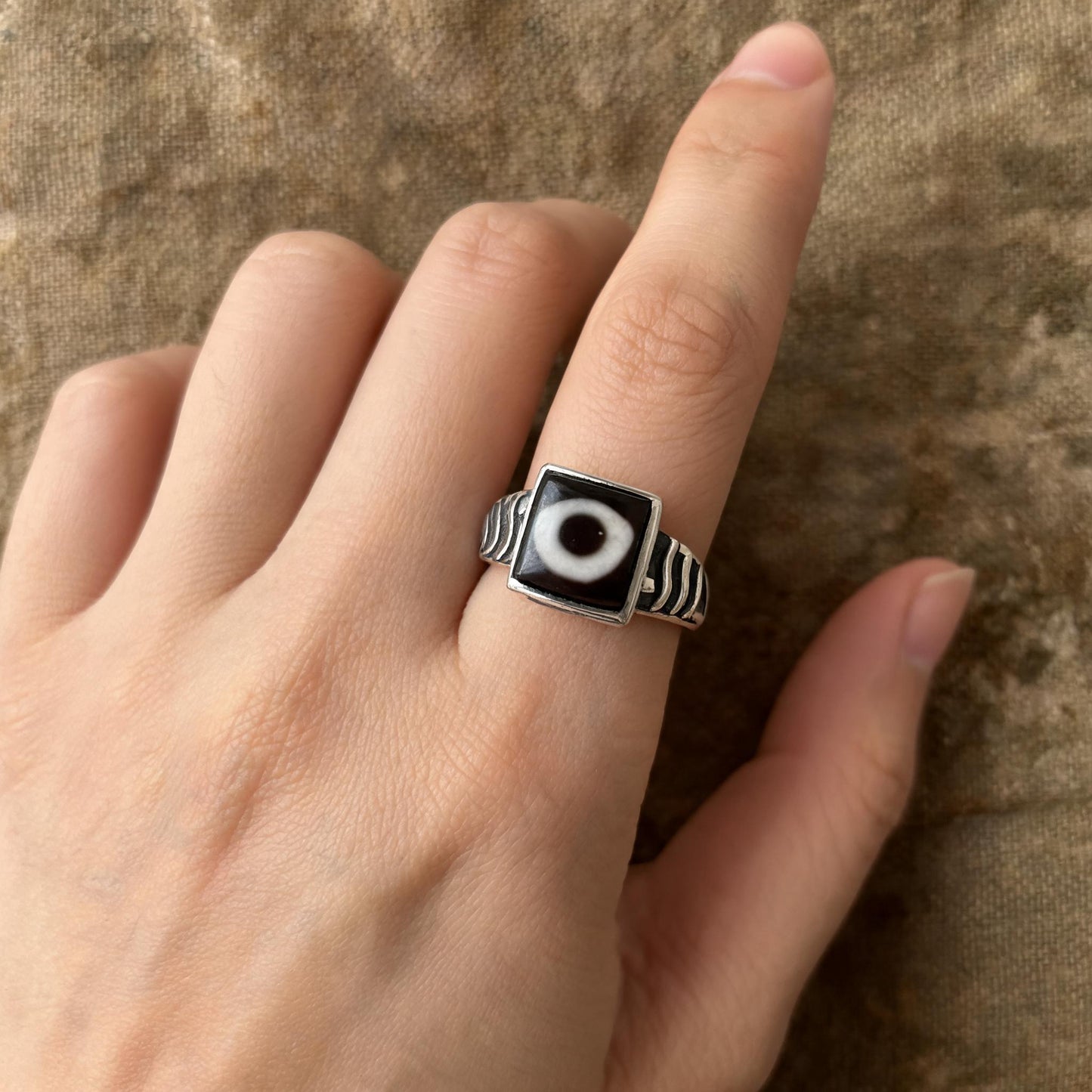 Handcrafted one-eyed Dzi S925 adjustable ring style 4 wearing scale view