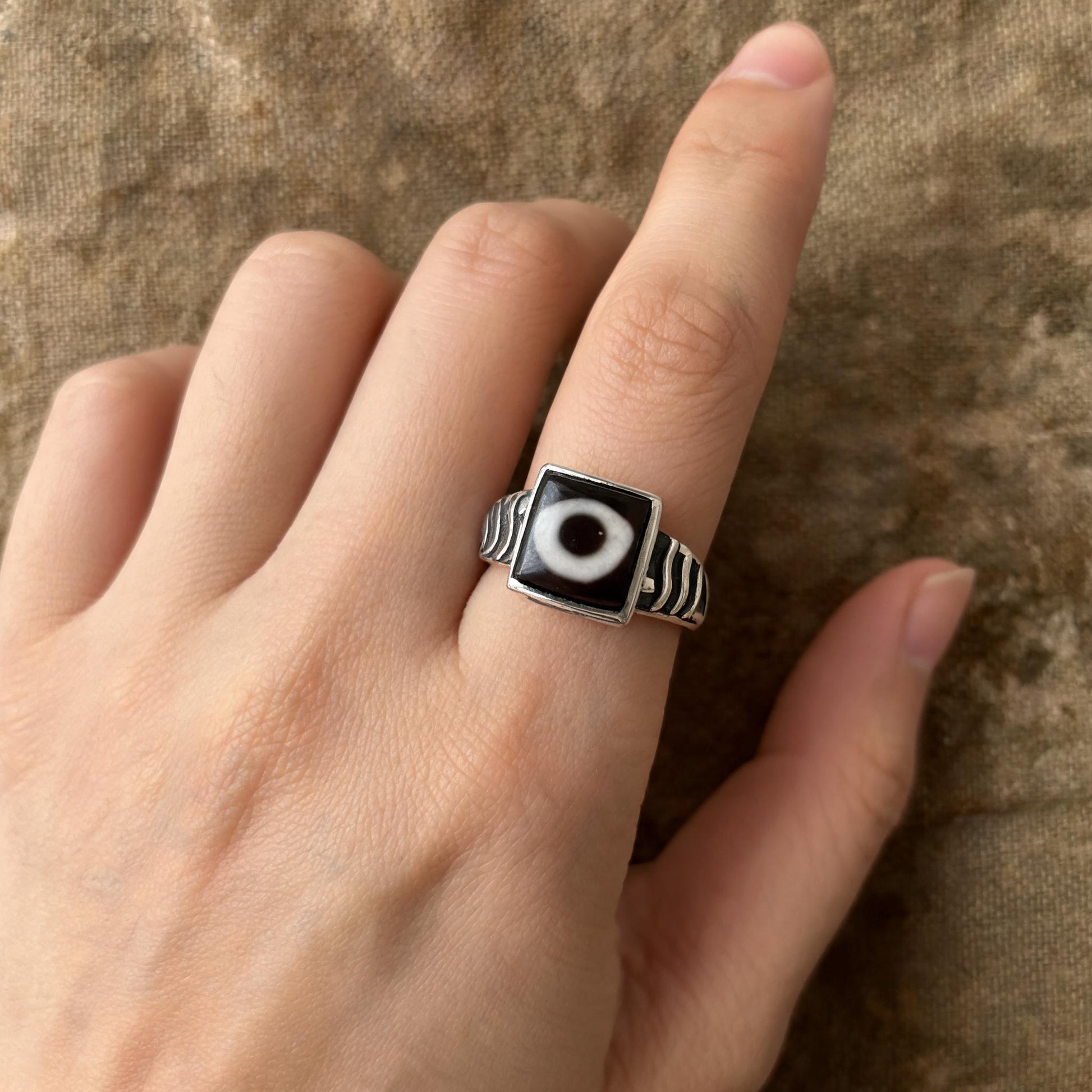 Handcrafted one-eyed Dzi S925 adjustable ring style 4 wearing scale view