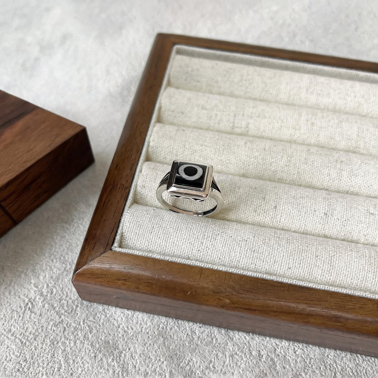 Handcrafted one-eyed Dzi S925 adjustable ring style 7 silver setting side view