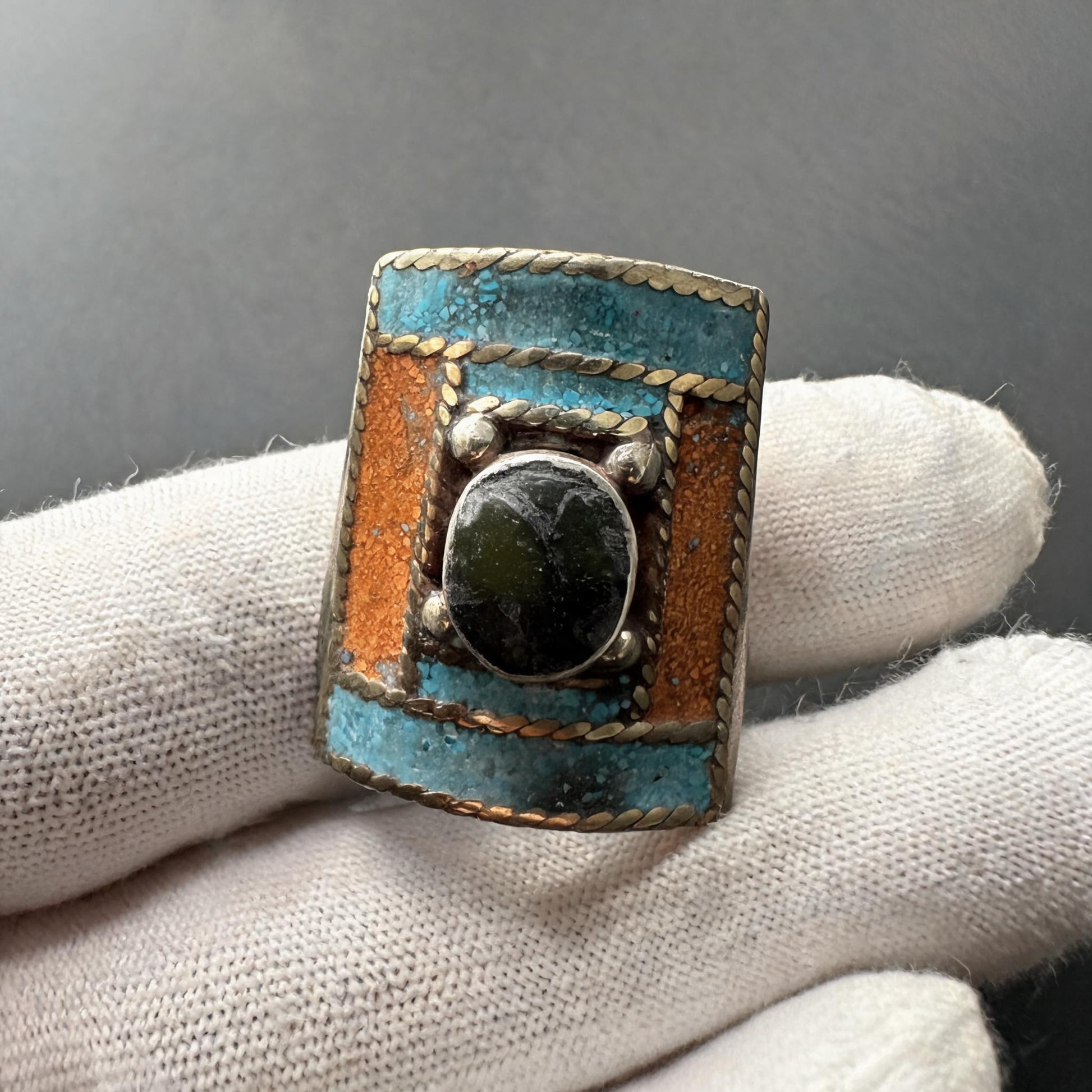 Hand-inlaid statement ring white-glove inspection scale