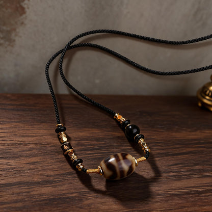 Handcrafted Three-Eye Dzi & Coconut Shell Necklace - handcraft detail