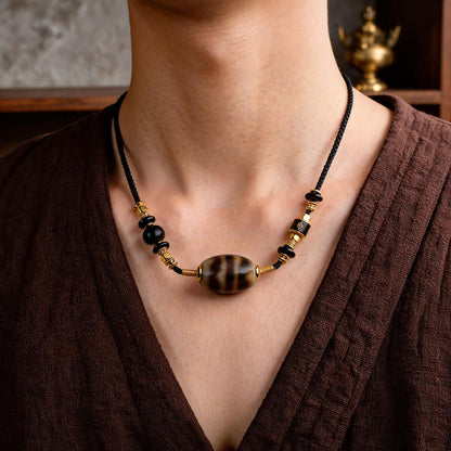 Handcrafted Three-Eye Dzi & Coconut Shell Necklace - wearing scale