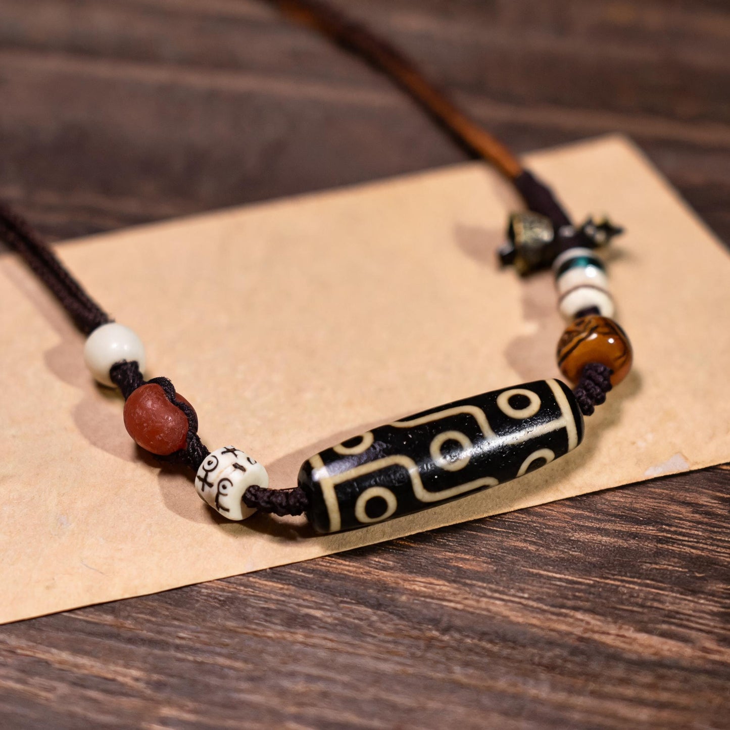 Handcrafted Horizontal Nine-Eye Dzi Necklace - three-quarter structure