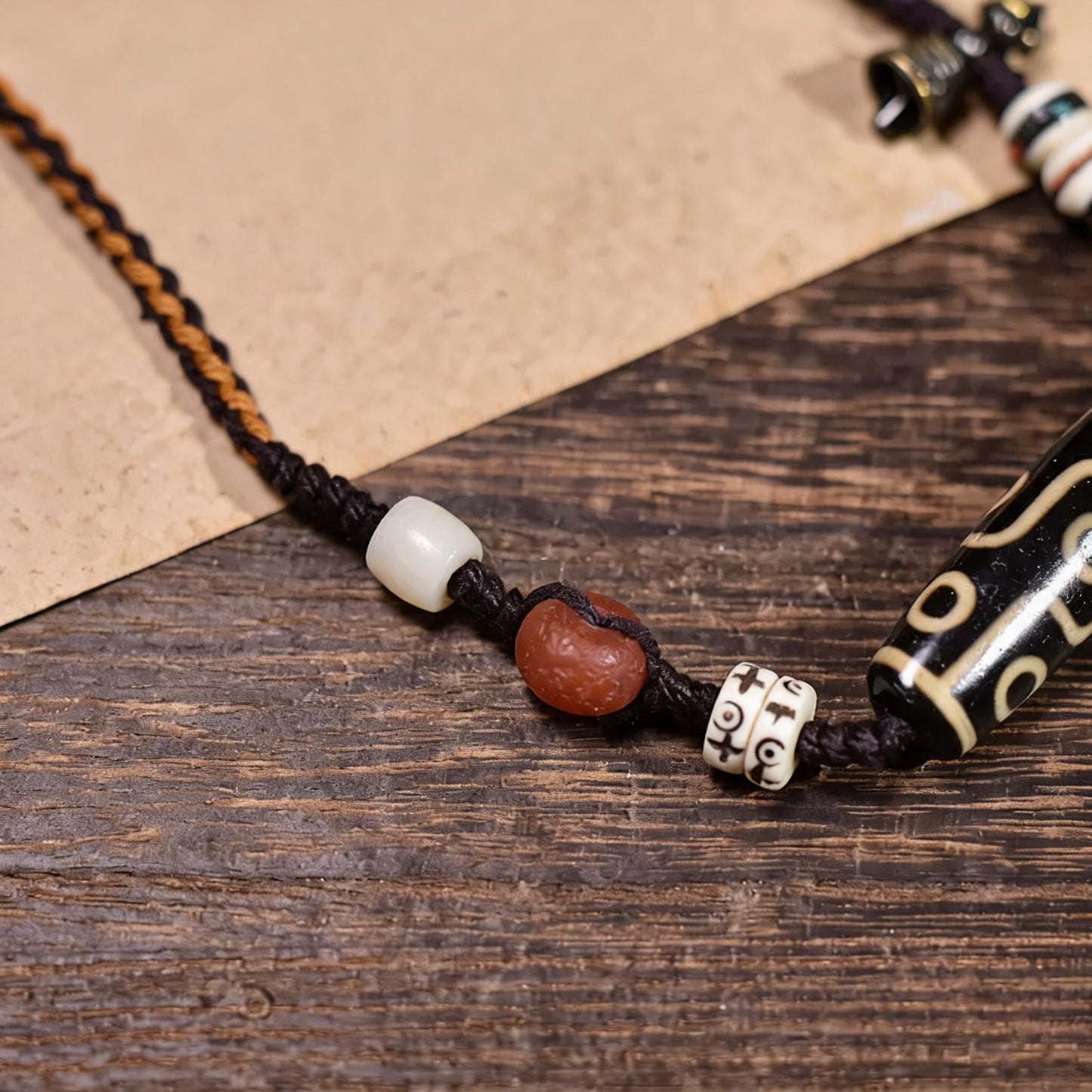 Handcrafted Horizontal Nine-Eye Dzi Necklace - handcraft detail