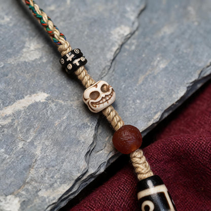 Handcrafted Nine-Eye Dzi Braided Necklace - Dzi surface macro