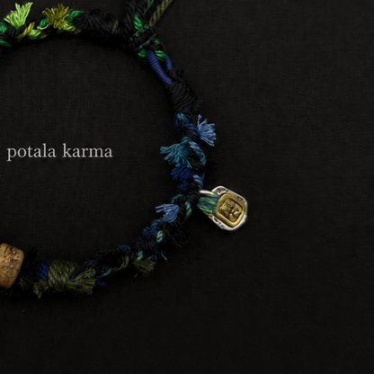 Handcrafted Forest Green Braided Charm Bracelet - decorative charm and bead detail