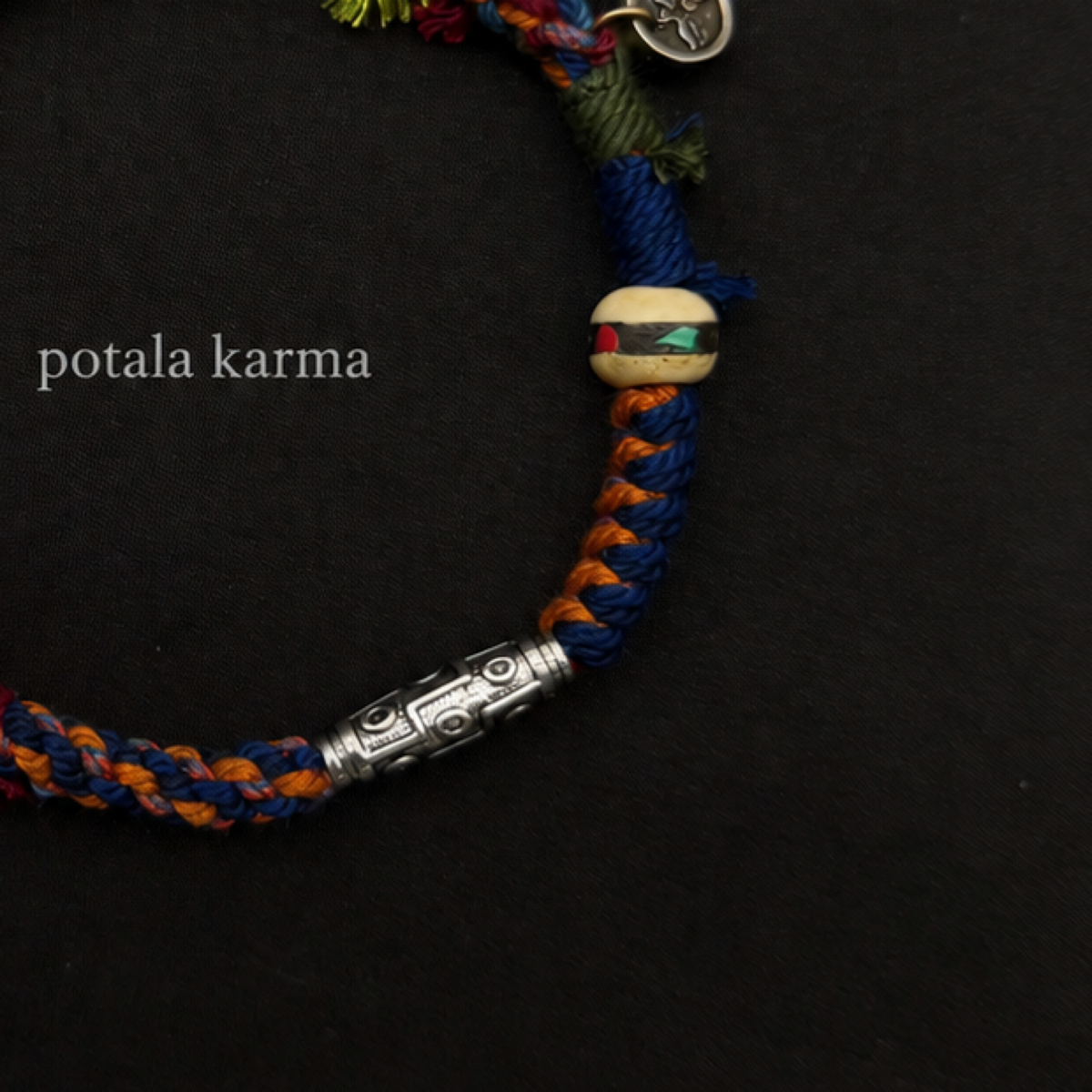 Handcrafted Turquoise & Orange Braided Charm Bracelet - decorative charm and bead detail