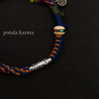 Handcrafted Turquoise & Orange Braided Charm Bracelet - decorative charm and bead detail