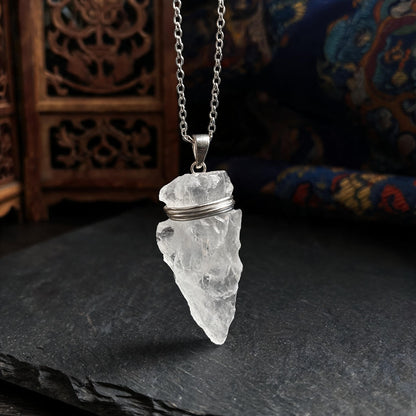 Clear quartz arrowhead pendant necklace with silver chain three quarter view