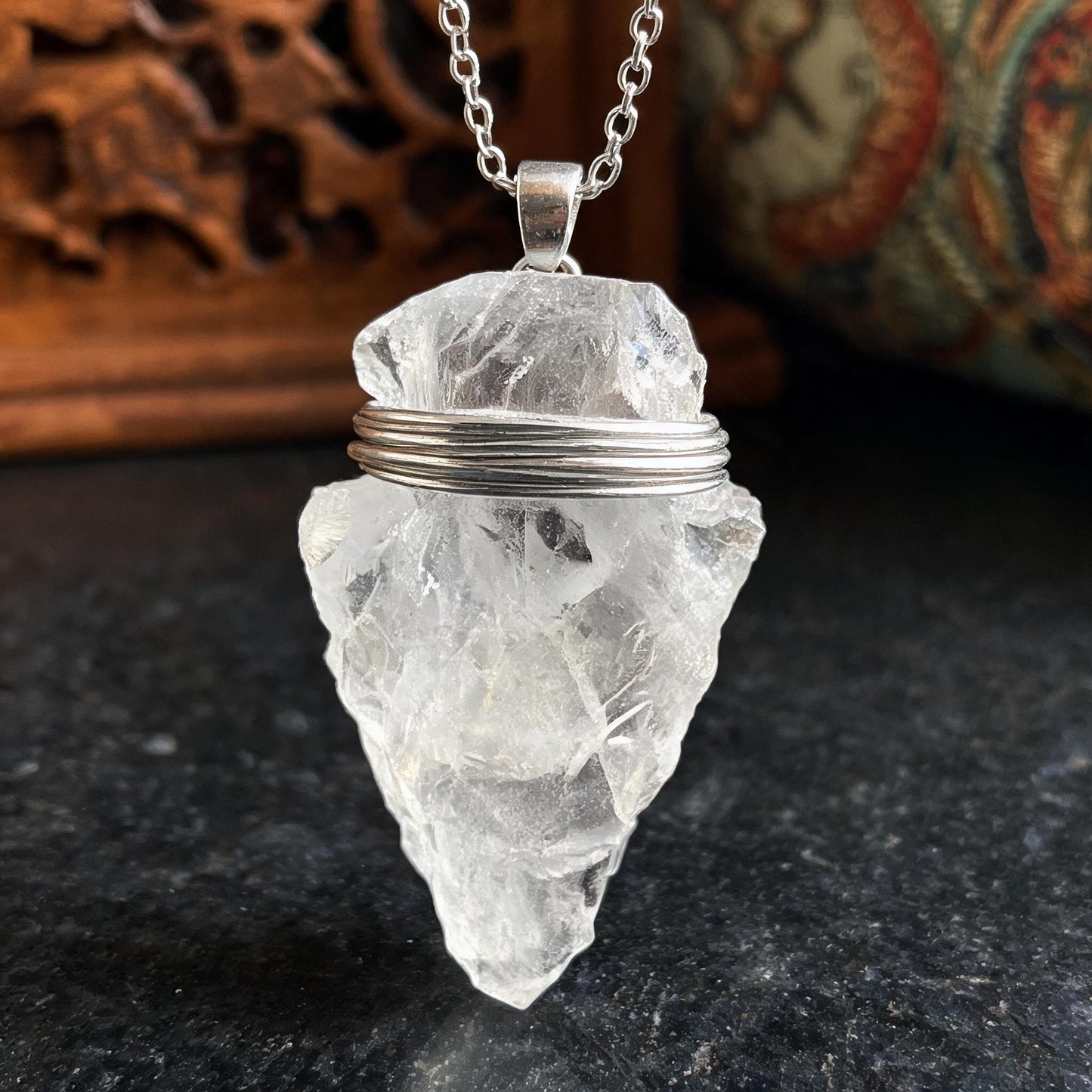 Clear quartz arrowhead pendant necklace with silver chain wire wrapping detail
