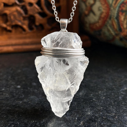 Clear quartz arrowhead pendant necklace with silver chain wire wrapping detail