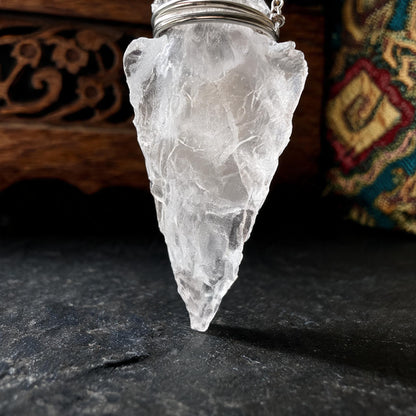Clear quartz arrowhead pendant necklace with silver chain crystal tip detail
