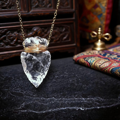 Clear quartz arrowhead pendant necklace with gold wrapped chain front view
