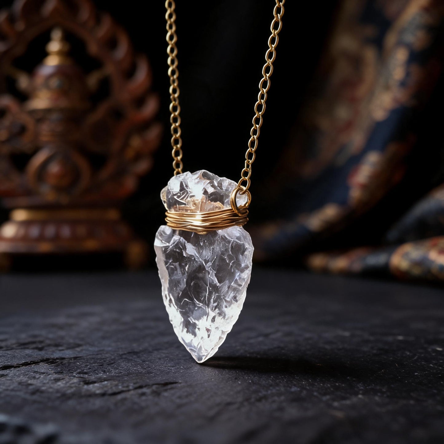 Clear quartz arrowhead pendant necklace with gold wrapped chain three quarter view