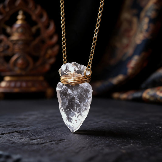 Clear quartz arrowhead pendant necklace with gold wrapped chain three quarter view