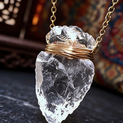 Clear quartz arrowhead pendant necklace with gold wrapped chain wire wrapping detail