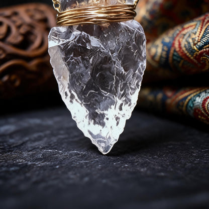 Clear quartz arrowhead pendant necklace with gold wrapped chain crystal tip detail