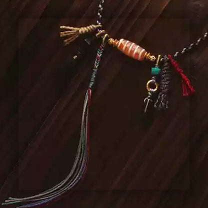 Handcrafted Tibetan agate Dzi bead multi strand necklace cord and tassel detail