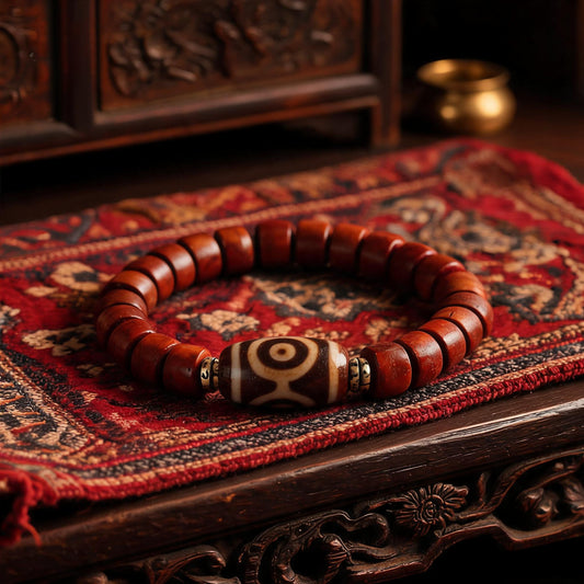 Dema Three-Eye Dzi and yak bone bracelet front view