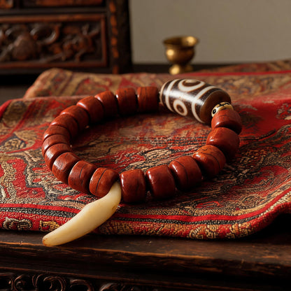 Dema Three-Eye Dzi and yak bone bracelet beadwork detail