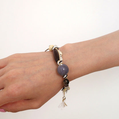 Blue Firework Agate Braided Bracelet wearing scale view