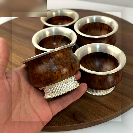 Tibetan wooden butter tea cup with white copper rim handheld scale view