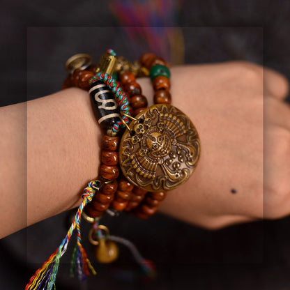 Collector grade Tibetan yak bone 108 mala with Dzi bead wrist wearing view