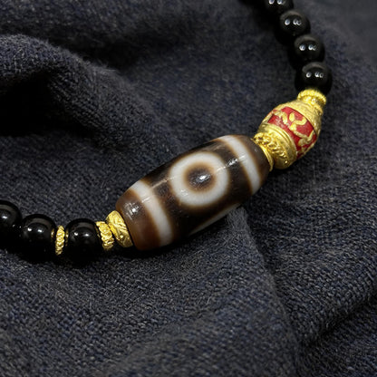 Design J dzi bead pendant detail close-up