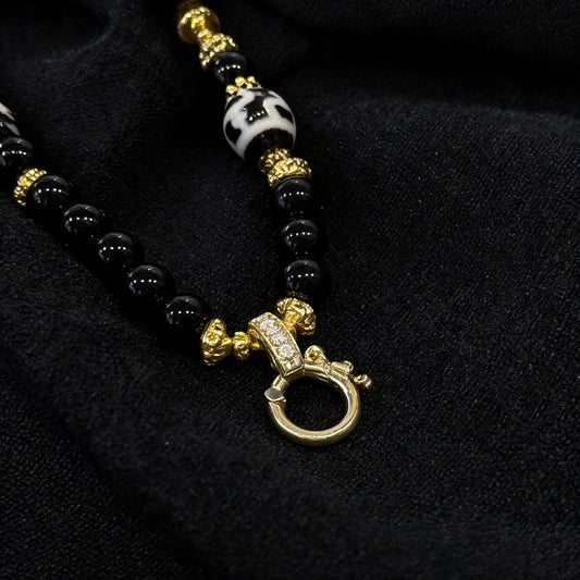 Design M dzi bead pendant detail close-up