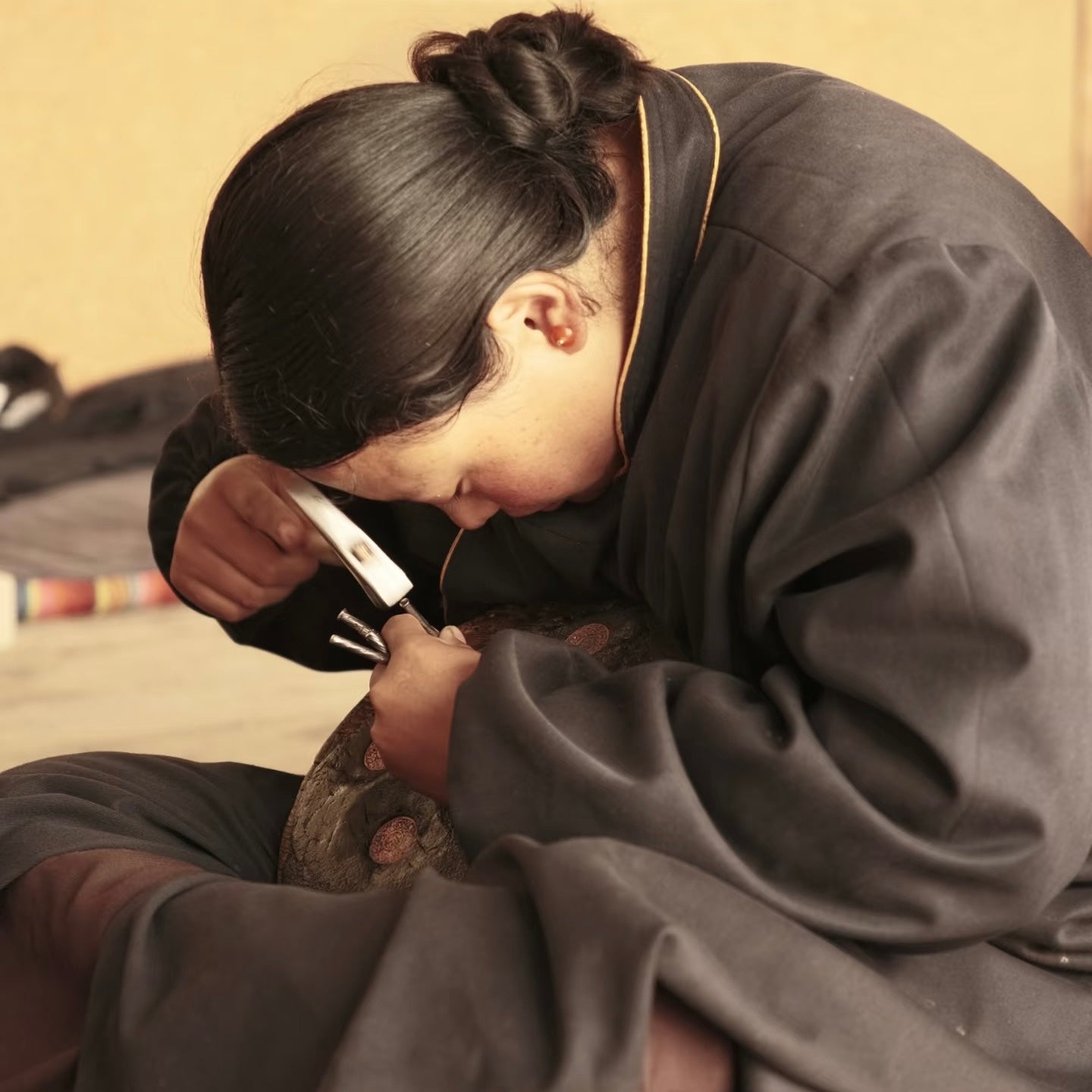 Artisan completing detailed handwork
