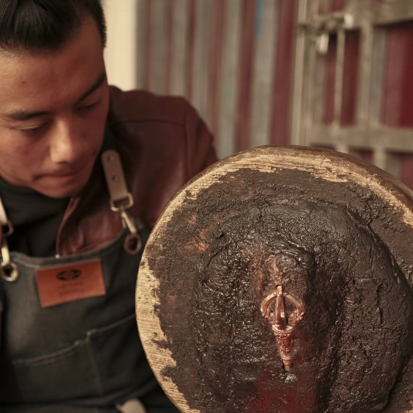 Artisan working beside a traditional mould
